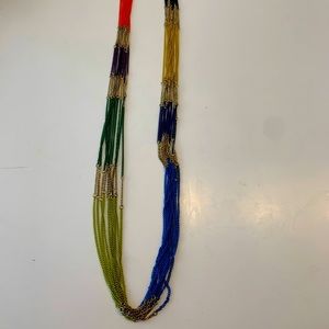 Multicolor chain necklace with tag.